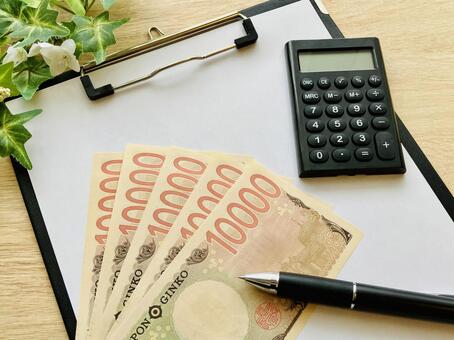 現金（1万円札5枚）と電卓とバインダー お金,金融資産,資金計画の写真素材